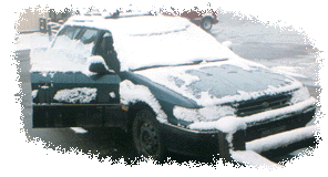 [snow-covered Subaru]